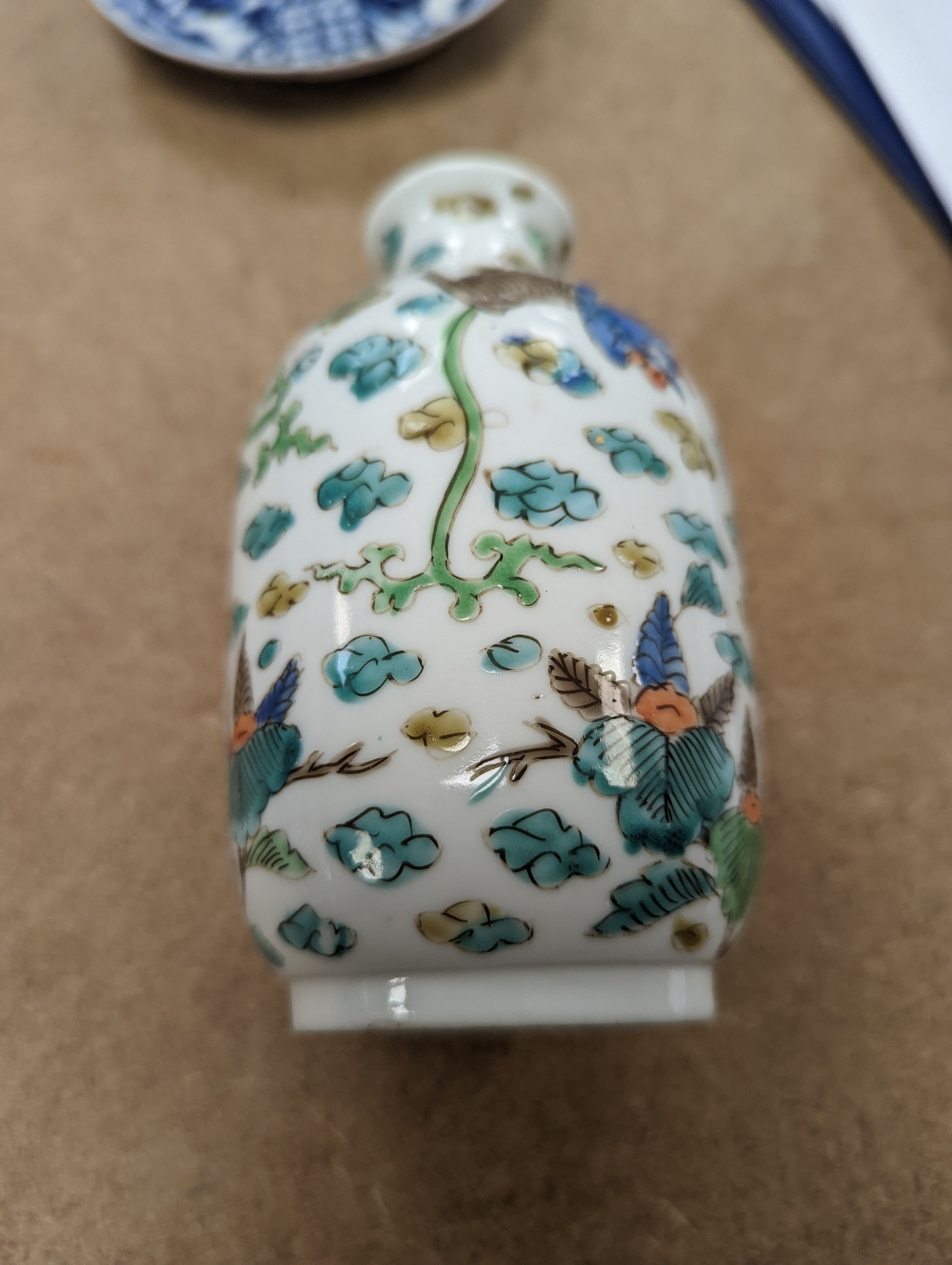 Two Chinese porcelain saucers, and a Chinese enamelled porcelain vase, 12.5cm., 18th century and later